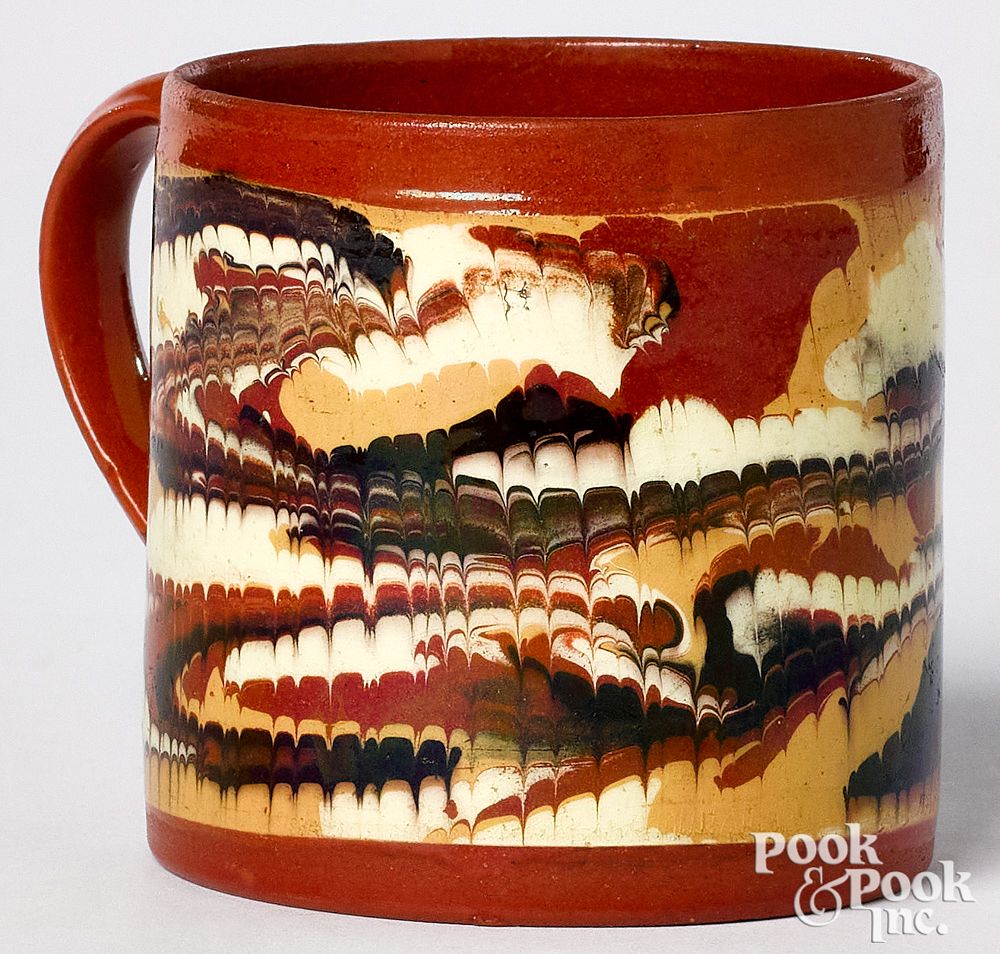 Appraisal: Mocha mug Mocha mug with combed marbleized glaze h Provenance