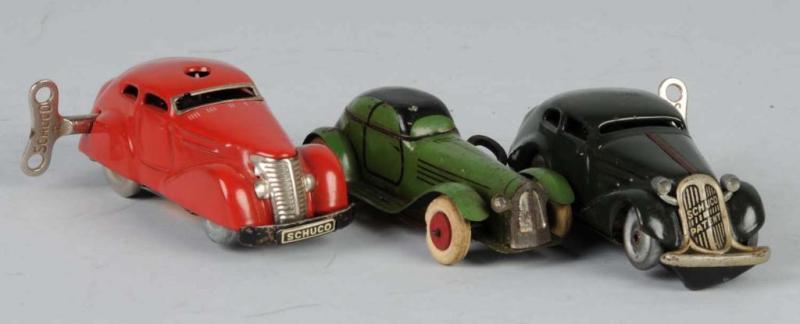 Appraisal: Lot of Small Tin Automobile Wind-Up Toys Description Includes two