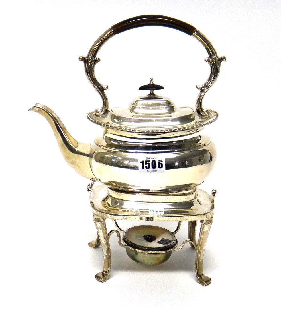 Appraisal: A silver spirit kettle of compressed form decorated with a