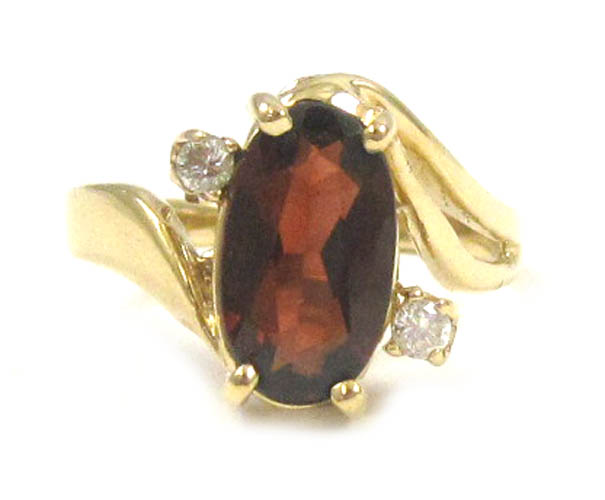 Appraisal: GARNET DIAMOND AND FOURTEEN KARAT GOLD RING with two round-cut