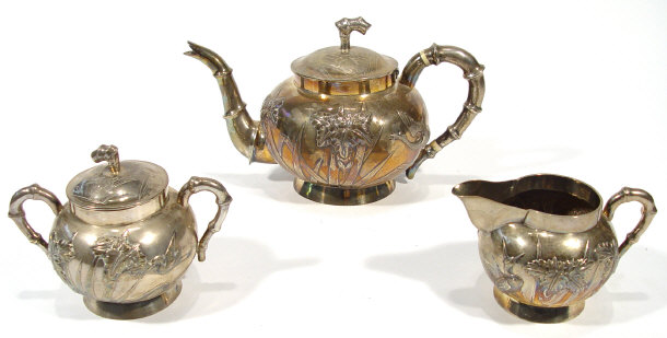 Appraisal: Chinese silver three piece teaset the bodies embossed with cranes