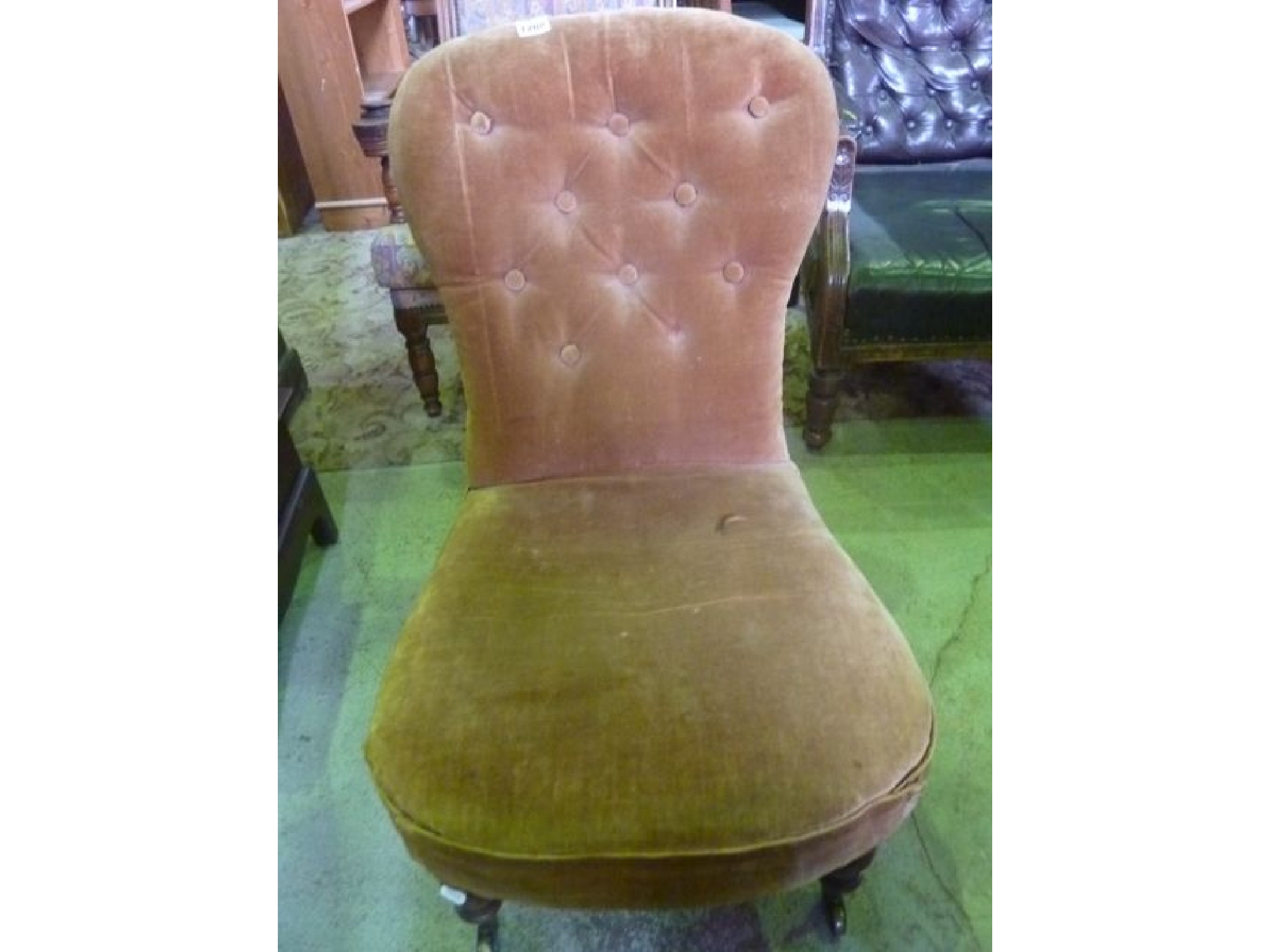 Appraisal: A Victorian low nursing occasional chair with upholstered seat and