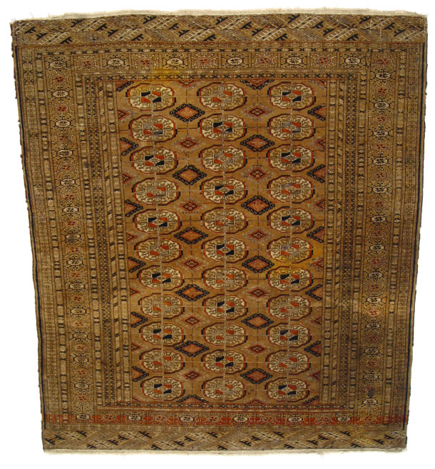 Appraisal: Rectangular brown ground rug decorated with geometric orange and black