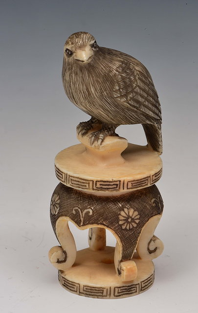 Appraisal: A Japanese ivory netsuke of a bird of preyMeiji periodsigned