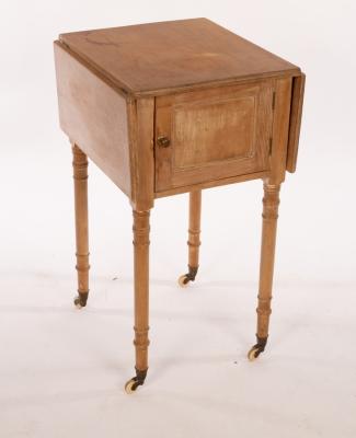 Appraisal: A pine two-flap bedside cupboard on turned legs cm wide