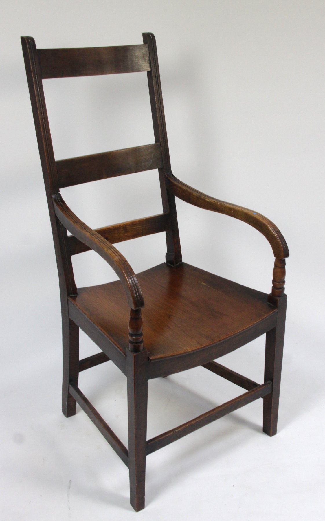 Appraisal: A th Century mahogany fruitwood armchair with ladder back and