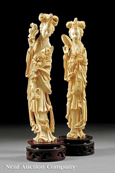 Appraisal: Two Carved Ivory Figures of Maidens each elegantly attired and