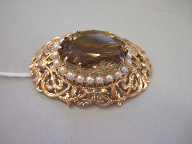 Appraisal: A gold smoky quartz and cultured pearl set oval pendant