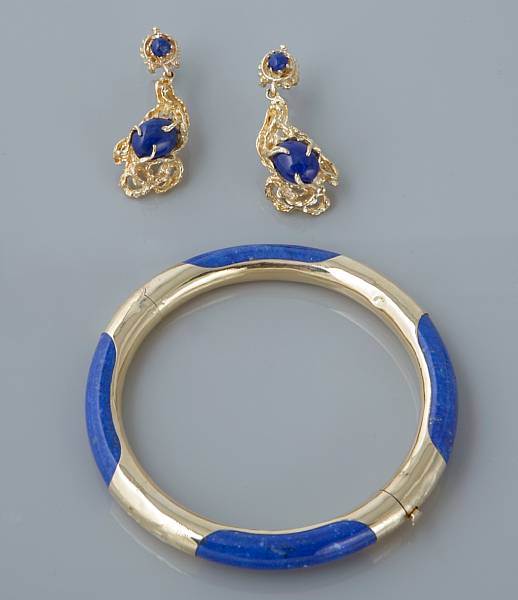 Appraisal: A lapis and gold bangle with a pair of lapis