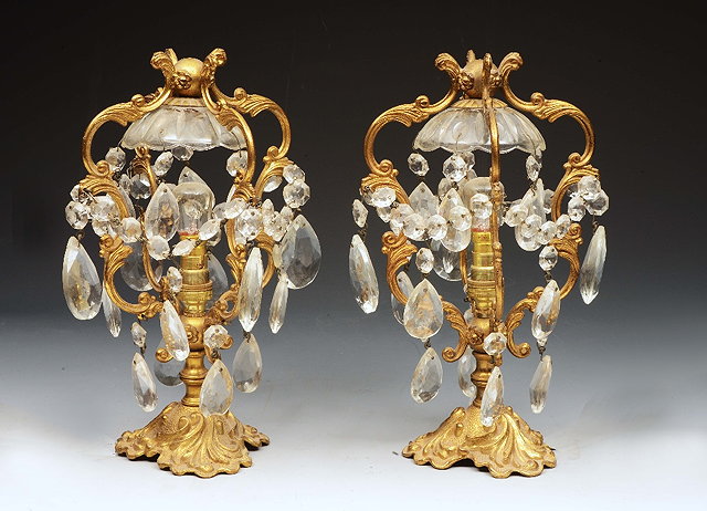 Appraisal: A PAIR OF GILT METAL TABLE LAMPS each with four