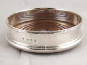 Appraisal: A silver wine coaster by the Goldsmiths and Silversmiths Co