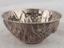 Appraisal: A Japanese silver bowl heavily embossed with flowers approx cm