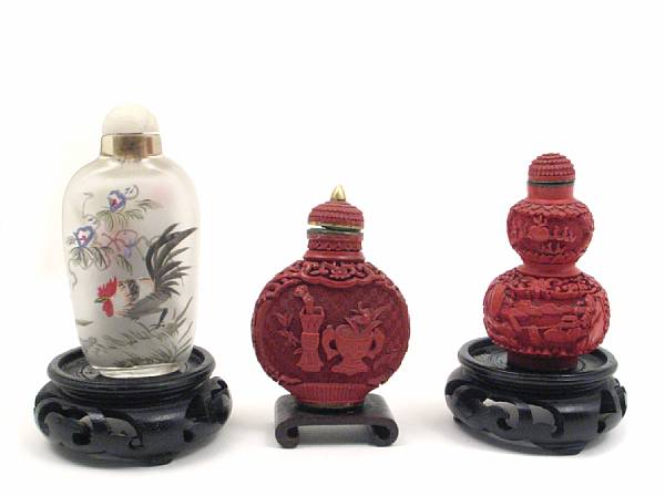 Appraisal: A group of three snuff bottles comprising two cinnabar lacquer