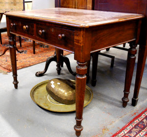 Appraisal: A small Victorian mahogany library writing table the rectangular round