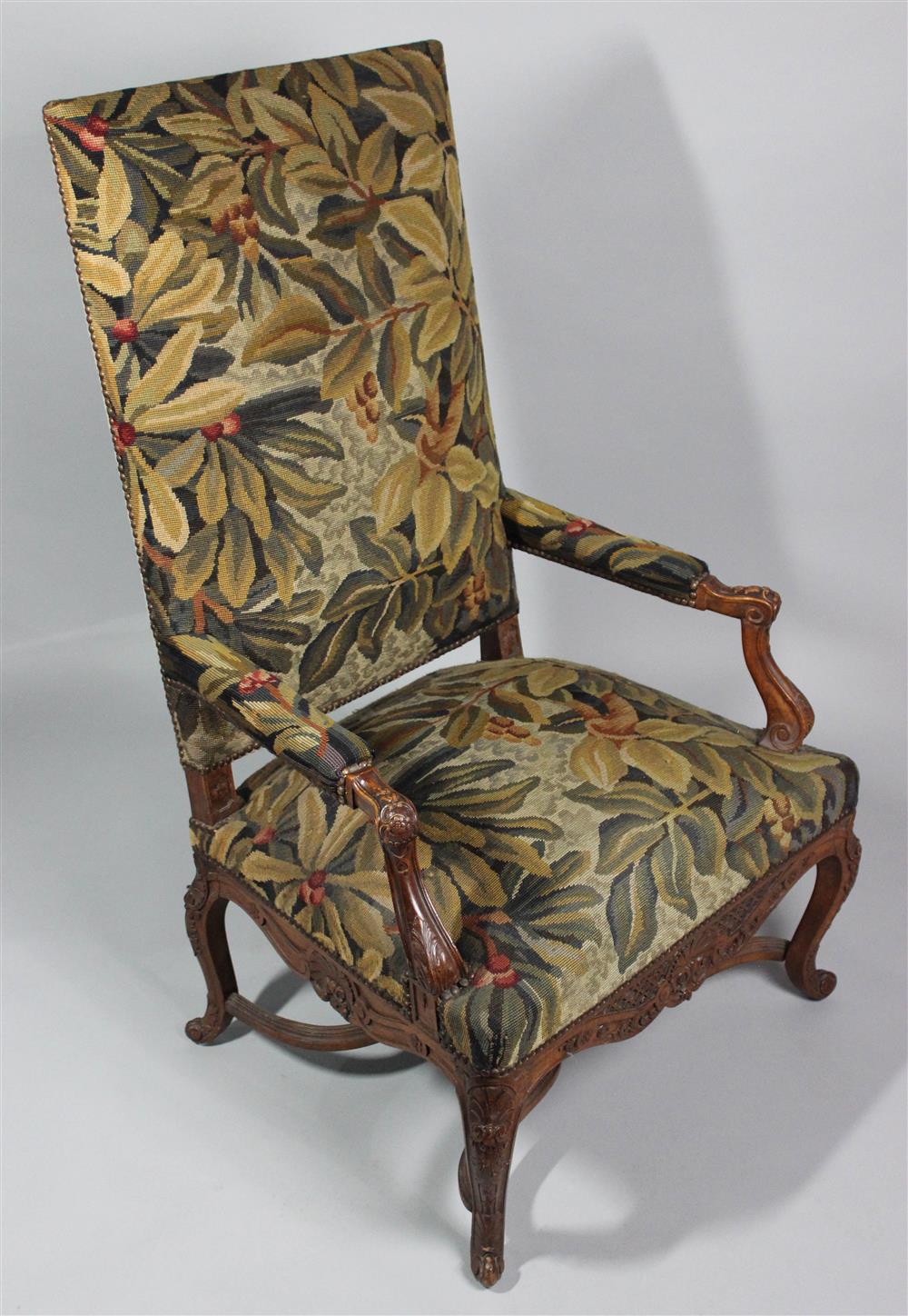 Appraisal: CARVED WALNUT LOUIS XV STYLE LIBRARY CHAIR having a straight