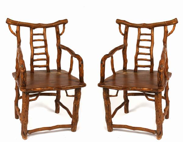 Appraisal: A pair of Chinese root form armchairs largest height in