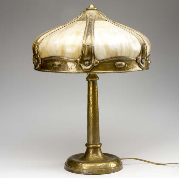 Appraisal: ARTS AND CRAFTS LIGHTING Table lamp with curved caramel slag