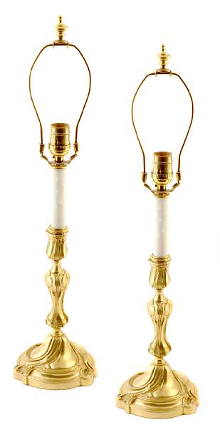 Appraisal: A pair of Louis XV style gilt bronze candelabrum now