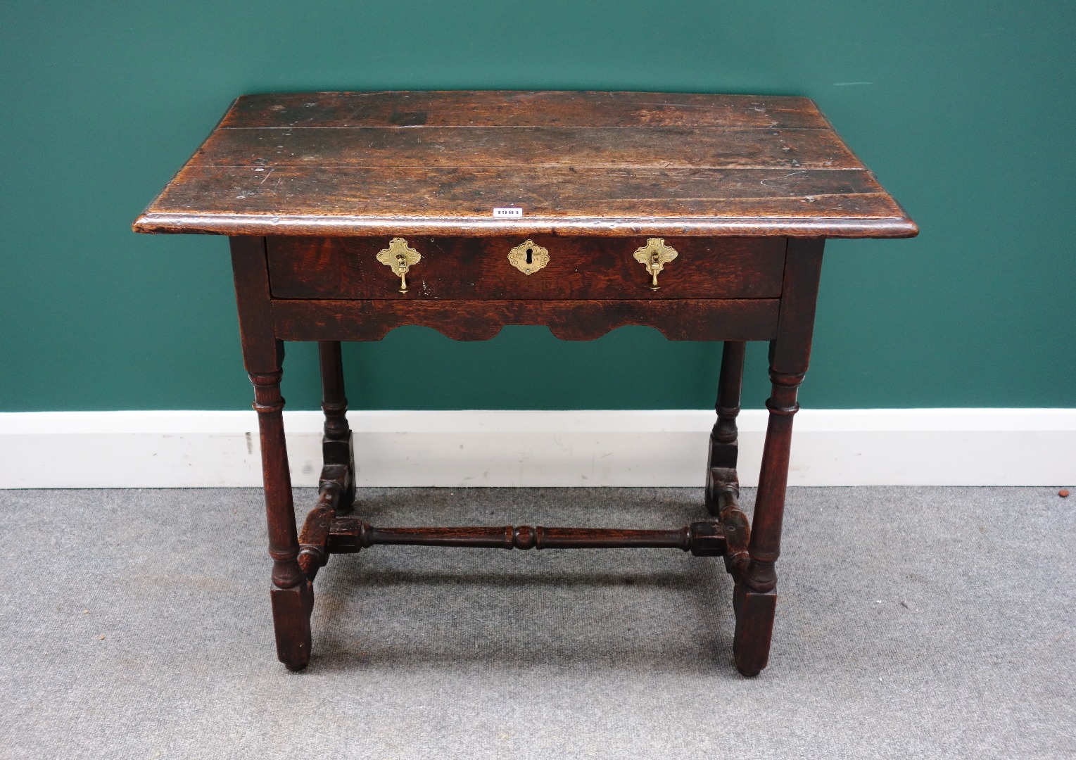 Appraisal: A William and Mary oak side table the plank top