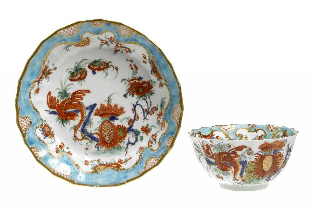 Appraisal: A WORCESTER WIDELY FLUTED TEA BOWL AND SAUCER painted in