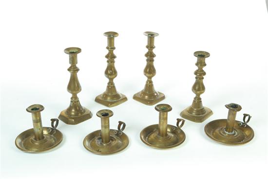 Appraisal: EIGHT BRASS CANDLESTICKS American mid th century Four similar baluster-form