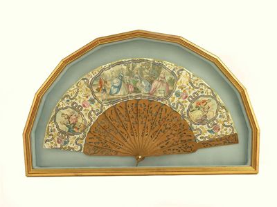 Appraisal: A fan c with carved and pierced wooden sticks with