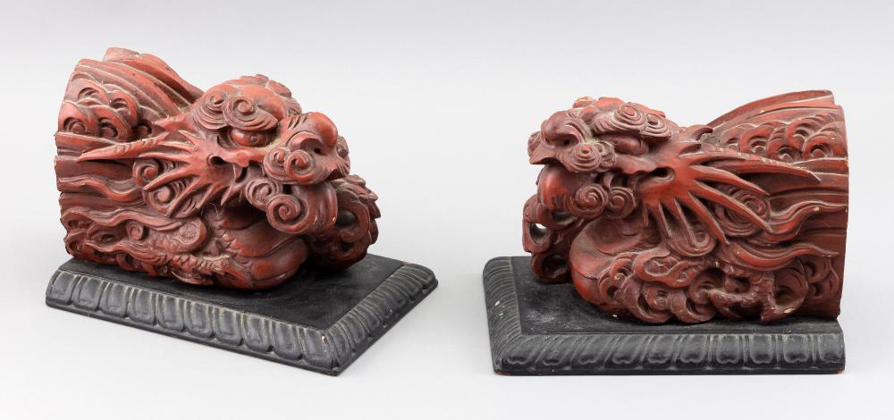 Appraisal: PAIR OF CHINESE RED LACQUERED WOOD QILIN HEADS LATE TH