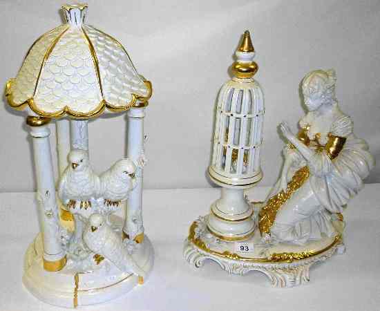 Appraisal: Large gilded pottery figure of a lady with birdcage height