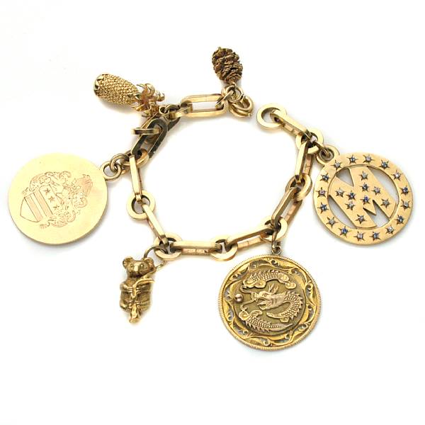 Appraisal: A fourteen karat gold charm bracelet with six charms grams