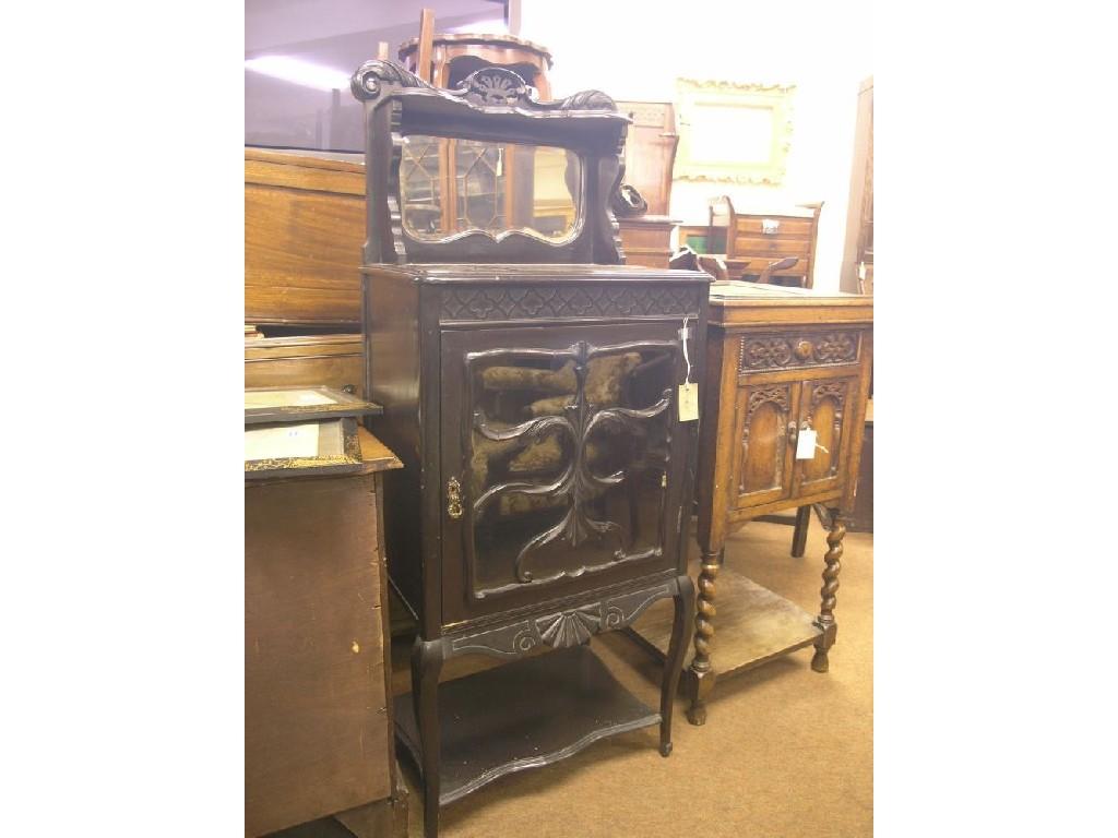 Appraisal: A Victorian Harrod's dark mahogany display cabinet mirrored overshelf with