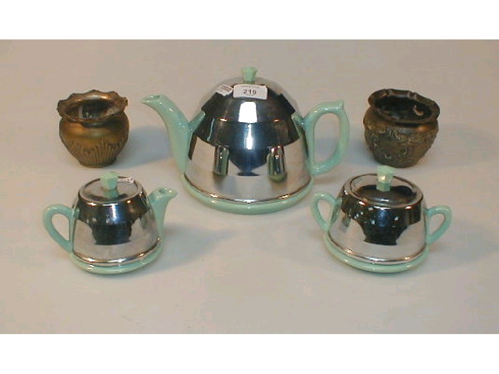 Appraisal: A Beverley three piece pottery and chrome plated tea set