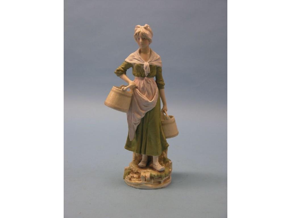 Appraisal: A Royal Dux porcelain figure milkmaid carrying two pails applied