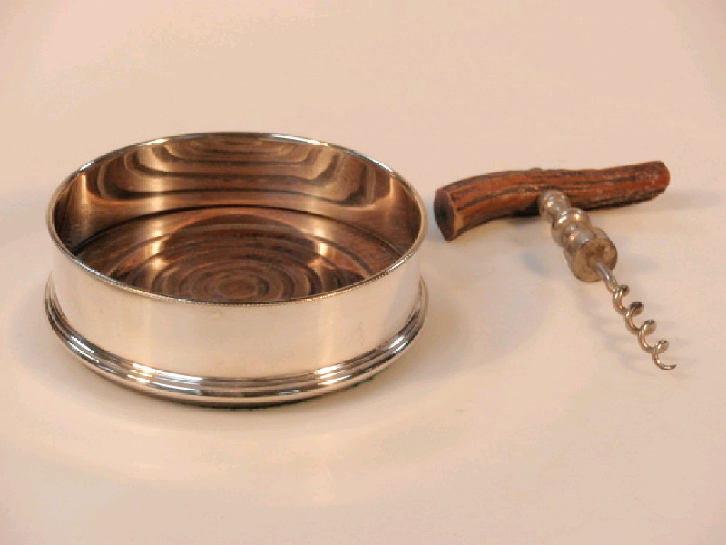 Appraisal: A modern silver wine coaster Birmingham with a turned wood