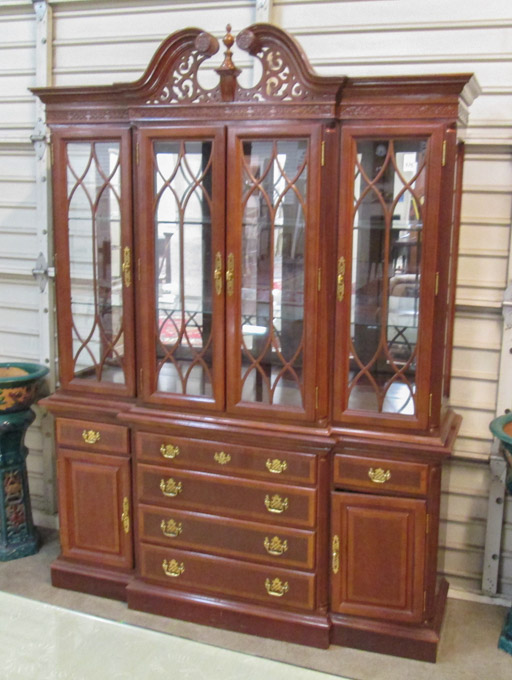 Appraisal: CHIPPENDALE STYLE MAHOGANY BREAKFRONT CHINA CABINET unknown maker dated in