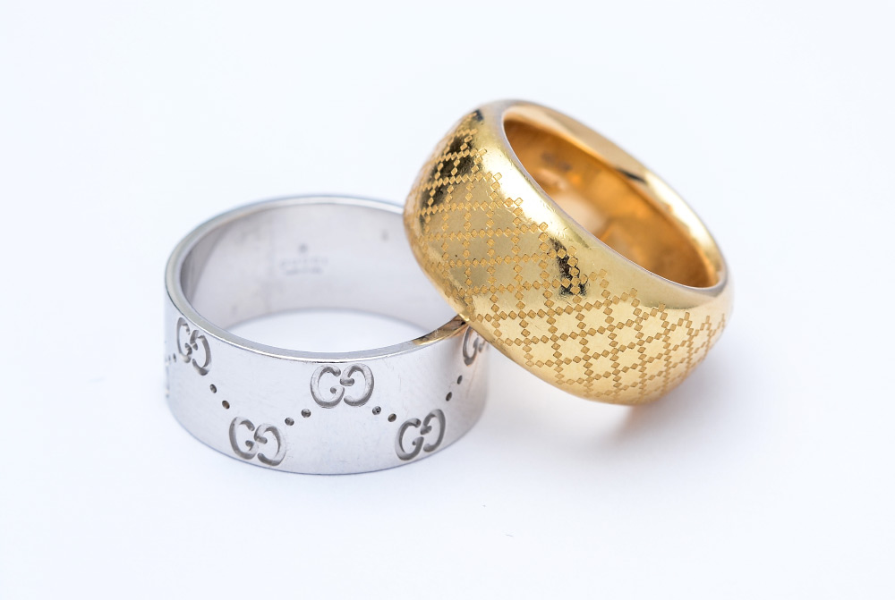 Appraisal: TWO K GOLD GUCCI WIDE BAND RINGS Yellow gold with