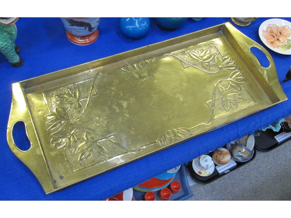 Appraisal: Arts and Crafts brass rectangular tray with repousse decoration of