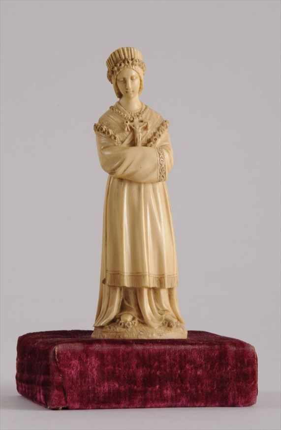 Appraisal: DUTCH CARVED IVORY FIGURE OF A GIRL Carved wearing rose