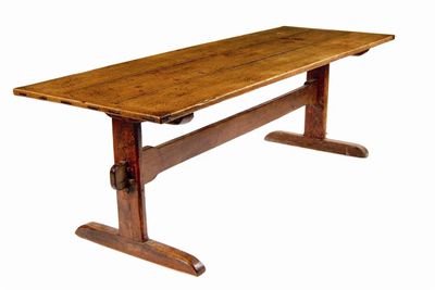 Appraisal: An oak refectory table the triple plank cleated top on