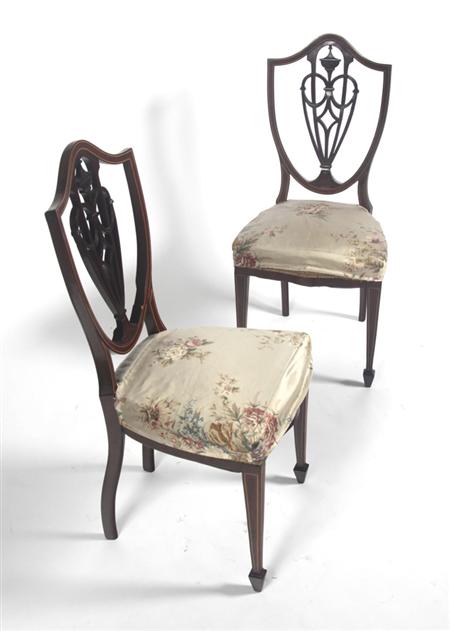 Appraisal: A pair of Hepplewhite style mahogany and inlaid shield back