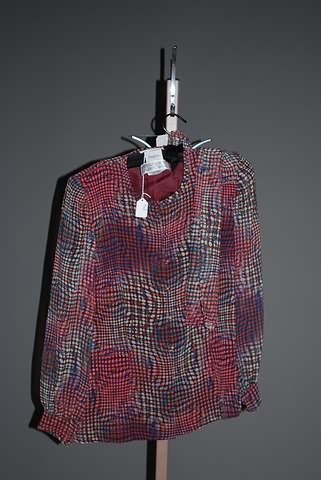 Appraisal: Andr Laug multi-color with circles sheer silk long sleeve blouse