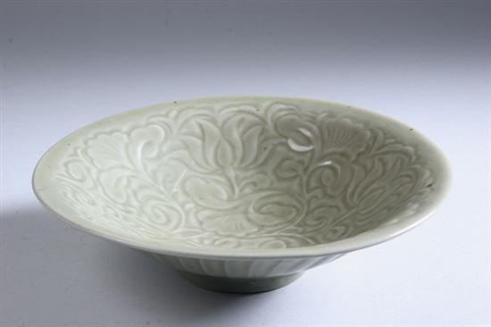 Appraisal: CHINESE CELADON PORCELAIN BOWL Qing Dynasty Incised lotus and scrolling