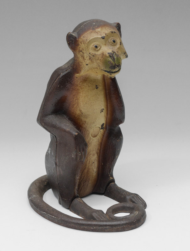 Appraisal: CAST IRON MONKEY DOORSTOP Figure of a seated monkey original