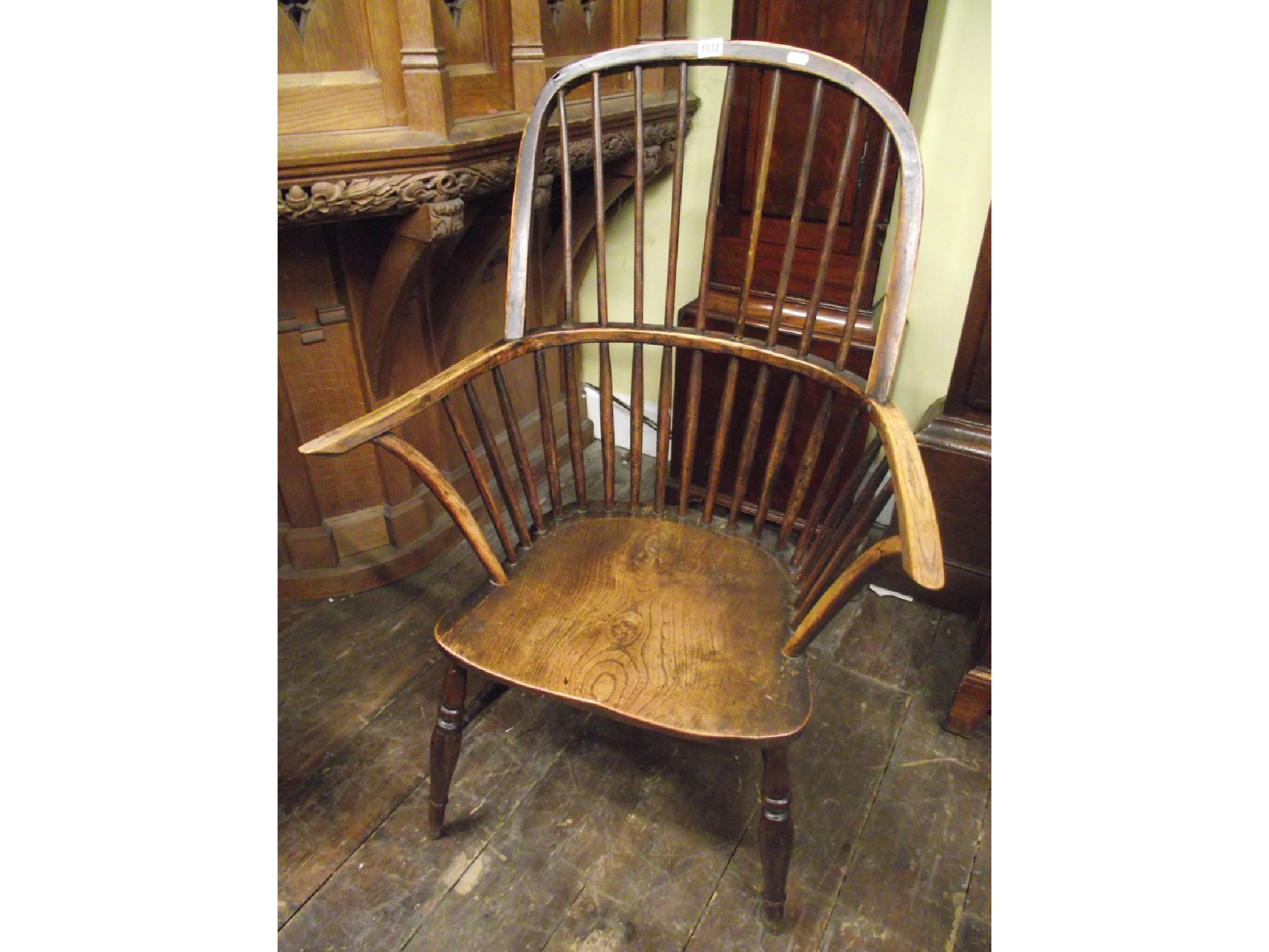 Appraisal: A Georgian comb back elbow chair with elm seat and