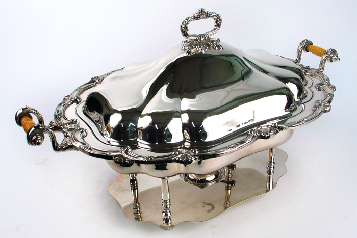 Appraisal: A HOLIDAY SILVERPLATED COVERED WARMING SERVER having a removable inner