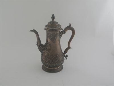 Appraisal: A George III coffee pot with embossing around the upper