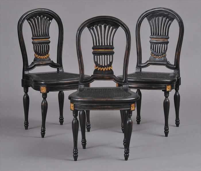 Appraisal: THREE LOUIS XVI-STYLE CARVED BLACK-PAINTED AND PARCEL-GILT CANE SEAT 'MONTGOLFIERE'