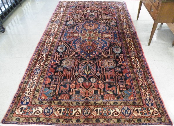 Appraisal: PERSIAN HAMADAN TRIBAL CARPET central medallion and stylized floral design