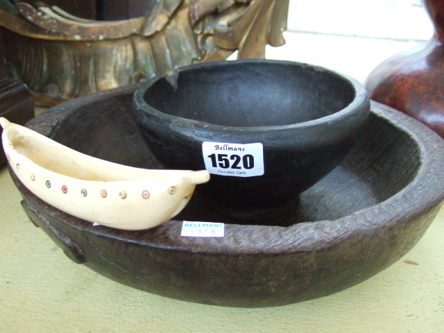 Appraisal: Tribal interest a turned wooden bowl with chip-carved rim and