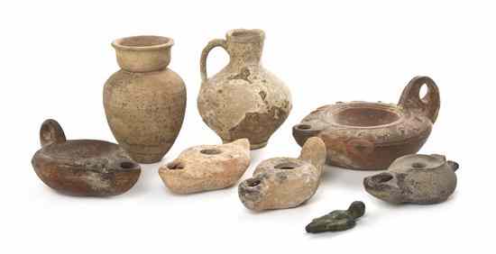 Appraisal: A Collection of Eight Antiquities comprising five ceramic oil lamps