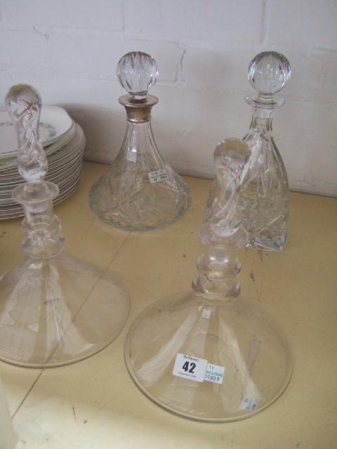 Appraisal: A pair of Powells two ring glass decanters with associated